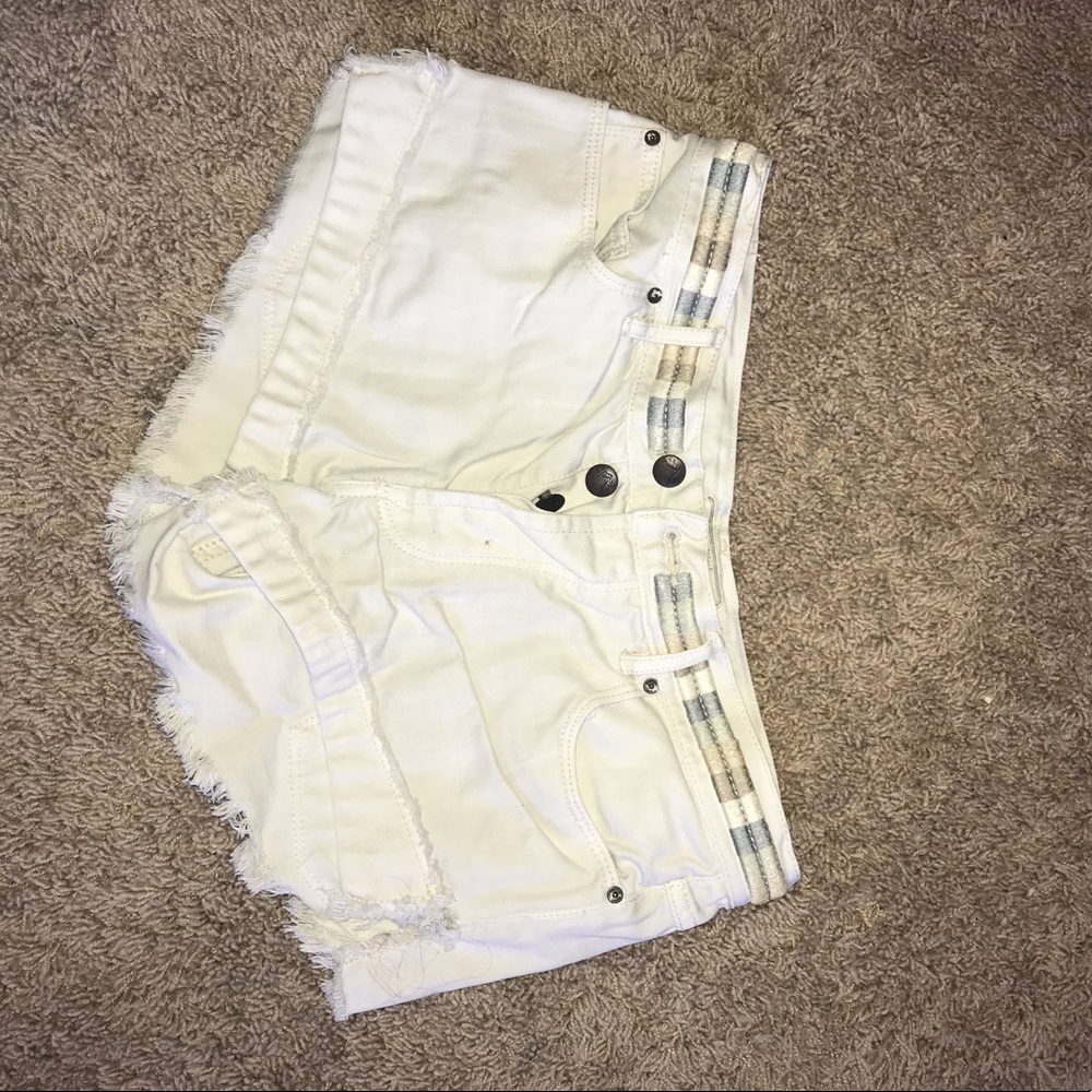 White denim shorts with patterned waistband